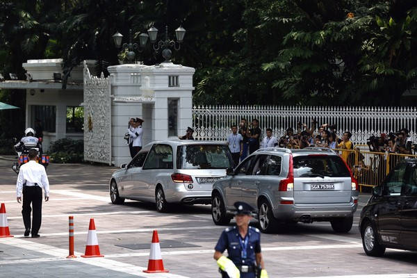 Crowds lining the road started to disperse after the motorcade entered the Istana compound.